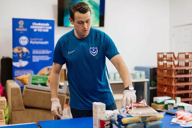 Martyn Pearce, from Pompey in the Community, organising food parcels . Picture: Joe Watson.