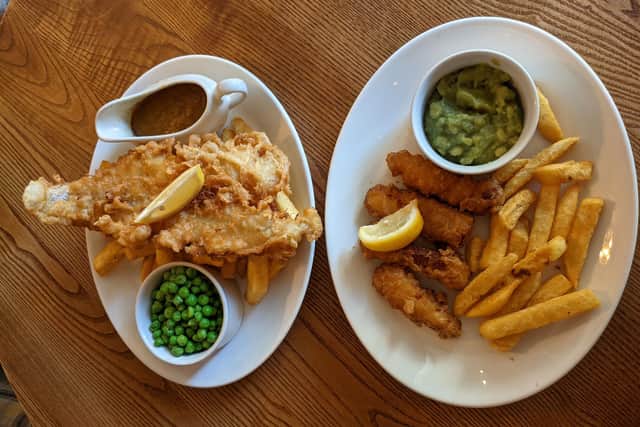 The Red Lion's fish and chips, left, and battered halloumi and chips