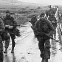 Royal Marines march into Port Stanley at the end of the war.