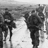 Royal Marines march into Port Stanley at the end of the war.