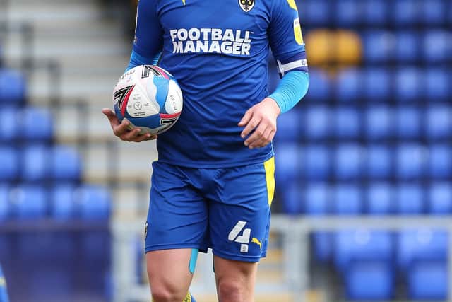 WIMBLEDON, ENGLAND - MARCH 27: Alex Woodyard of AFC Wimbledon in action during the Sky Bet League One match between AFC Wimbledon and Northampton Town at Plough Lane on March 27, 2021 in Wimbledon, England. Sporting stadiums around the UK remain under strict restrictions due to the Coronavirus Pandemic as Government social distancing laws prohibit fans inside venues resulting in games being played behind closed doors.  (Photo by Pete Norton/Getty Images)
