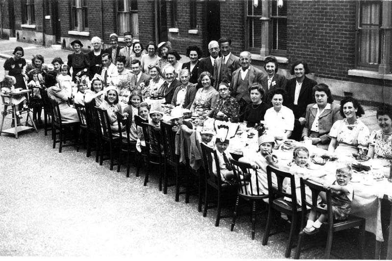 VE Day party. Residents of Silchester Road, Baffins, Copnor at their 'do' celebrating the end of the conflict in Europe in 1945.
sent in by Jacqueline Rayner nee Copping of Widley her brother Roger is to the front right with legs through the back of the chair and Jacqueline is to his left.  
Three of her cousins Janet and Heather,now resident in New Zealand and Wendy, now in South Africa are also in the picture.