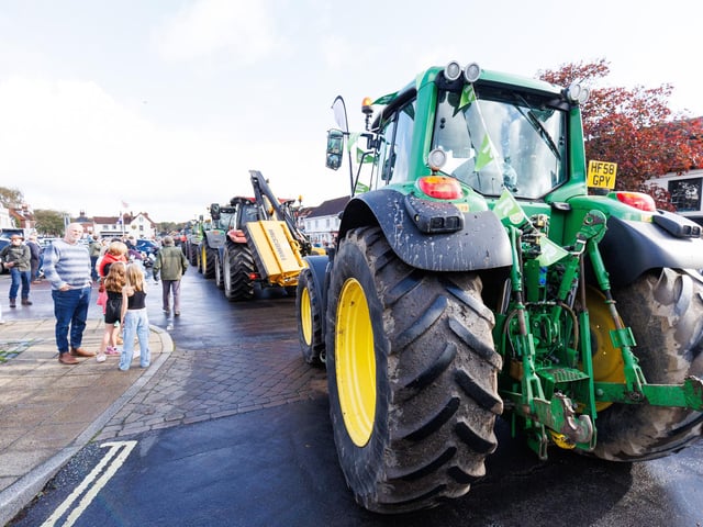 Crowds gathered in Wickham Square to watch the procession of tractors go by all to raise money for Rowans Hospice and Guide Dogs.