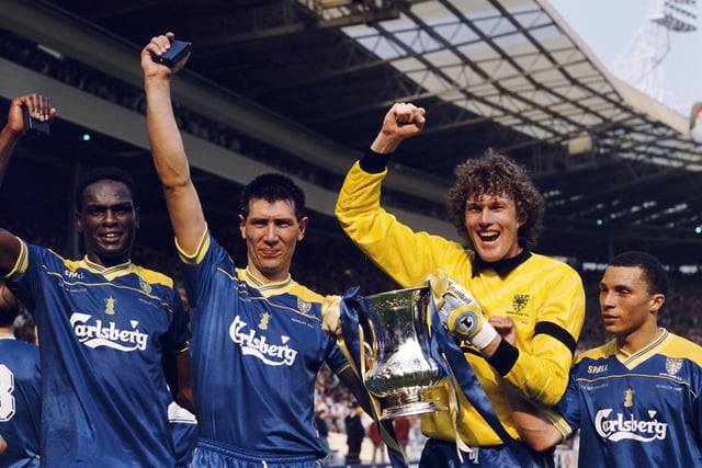 FA Cup magic - Wimbledon quartet Eric Young, Lawrie Sanchez, Dave Beasant and Terry Phelan celebrate after the Dons' 1-0 win against Liverpool. Picture: David Cannon/Allsport/Getty Images