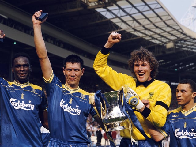 FA Cup magic - Wimbledon quartet Eric Young, Lawrie Sanchez, Dave Beasant and Terry Phelan celebrate after the Dons' 1-0 win against Liverpool. Picture: David Cannon/Allsport/Getty Images