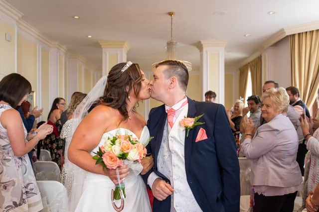 Laura and Russell on their wedding day. Picture: Carla Mortimer Photography.