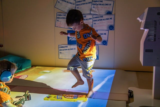 Maxwell Sevilha (4) tries out the interactive floor game in the sensory room at The Rainbow Centre. Picture: Mike Cooter (240623)