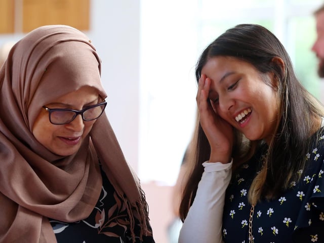 Juhi Miah, right, and her mother, Rowshonara Rotna. Juhi is going to read geography at Oxford. A-level results, Portsmouth High School, Southsea Picture: Chris Moorhouse (jpns 180822-11)