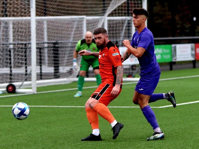 AFC Portchester's Ryan Woodford, left, and AFC Stoneham's Duarte Martins. Picture by Tom Phillips