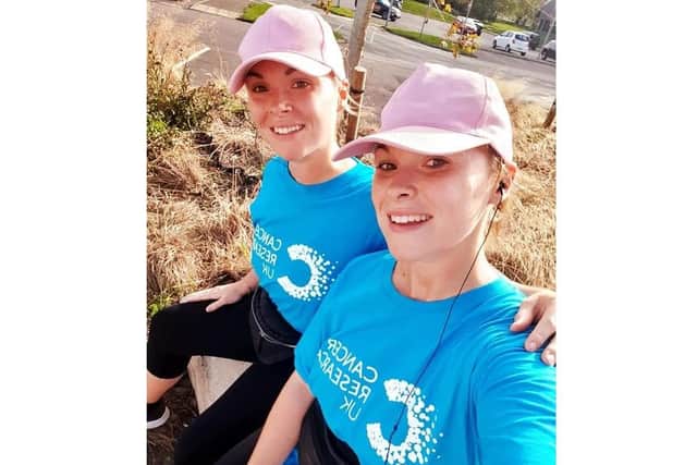 Twins Marcie and Sammie Mayhead ran two miles each day in September to raise funds for Macmillan Cancer Support and Cancer Research UK