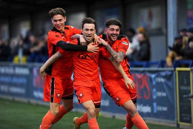Conor Bailey, middle, celebrates putting Portchester 2-0 up against former club Moneyfields at Westleigh Park.

Picture: Sarah Standing