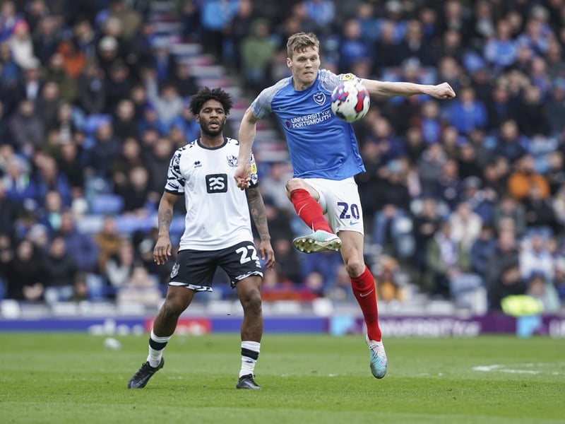 Sean Raggett clears ahead of former Pompey team-mate Ellis Harrison against Port Vale. Picture: Jason Brown/ProSportsImages