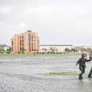 A family struggling against the wind in Southsea Common during Storm Henk. Picture: Habibur Rahman.
