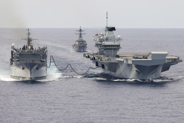 HMS Prince of Wales on a Replenish at Sea trial, taking on fuel from USNS Supply, on September 19, 2023.