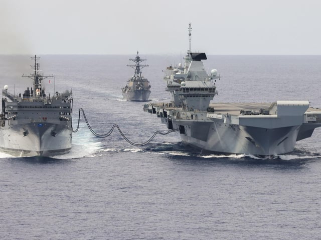 HMS Prince of Wales on a Replenish at Sea trial, taking on fuel from USNS Supply, on September 19, 2023.