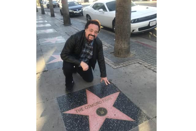 Jay Osmond with his family's star on the Hollywood Walk of Fame