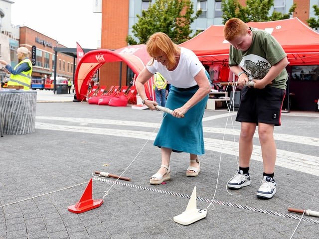 Jennifer Mead and her son Henry racing their boats on the Andrew Simpson stand.  Picture: Chris Moorhouse (160825-13)