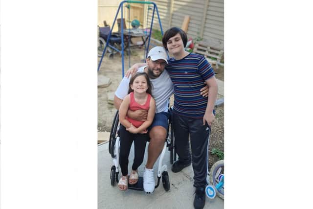 Former Royal Navy engineer Shane Henry, 43, with his children Callum, 12, and Abbie, six.