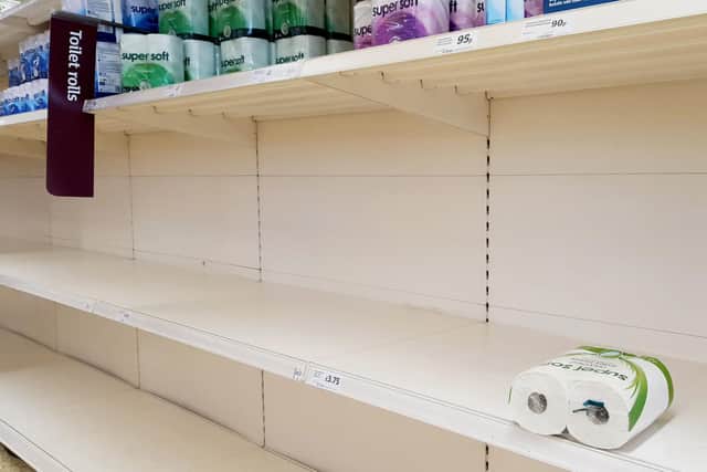 A view of empty shelves as toilet roll is almost sold out in a supermarket in Ashford, Kent. UK shoppers are stockpiling toilet paper, pasta, hand sanitiser and tinned foods as fears grow over the spread of the coronavirus. Pic: Gareth Fuller/PA Wire