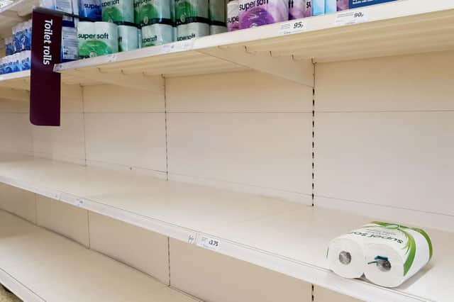 A view of empty shelves as toilet roll is almost sold out in a supermarket in Ashford, Kent. UK shoppers are stockpiling toilet paper, pasta, hand sanitiser and tinned foods as fears grow over the spread of the coronavirus. Pic: Gareth Fuller/PA Wire