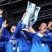 Michael Doyle lifts the League Two title aloft after Pompey's triumph in 2017. Picture: Joe Pepler