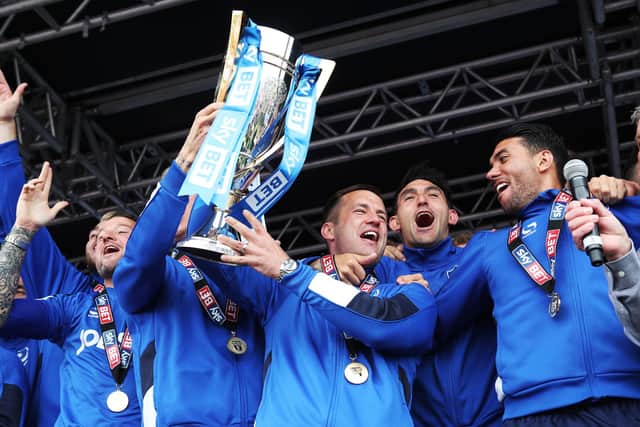 Michael Doyle lifts the League Two title aloft after Pompey's triumph in 2017. Picture: Joe Pepler