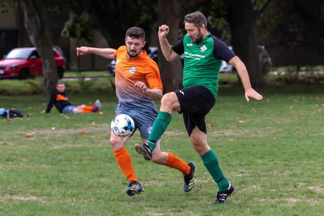 Man of the match Andrew Easton, left, scored twice in Soberton's shock Challenge Cup win over top flight North End Cosmos. Picture: Mike Cooter