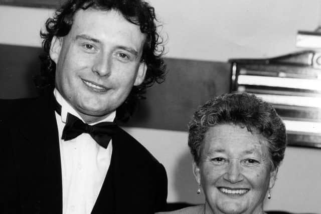 Jimmy White meets Mavis Lewis at The Top Spot Snooker Club in Leigh Park to make up for her disappointment of travelling from Wales to see him in Southsea earlier in 1993 when the show was cancelled. The News PP4530