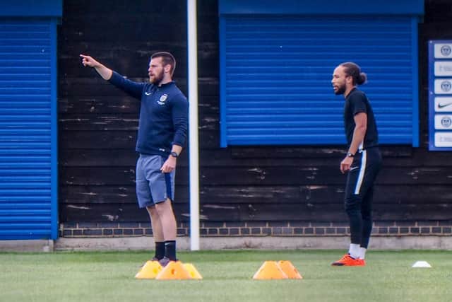 The majority of Pompey's players have visiting their Hilsea training ground at allocated times. Here Marcus Harness is pictured with physio Jack Hughes. Picture: Habibur Rahman