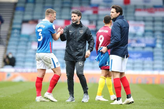 Danny Cowley celebrates with Lee Brown after marking his first game as Pompey head coach with a 2-1 victory over Ipswich in March 2021. Picture: Joe Pepler