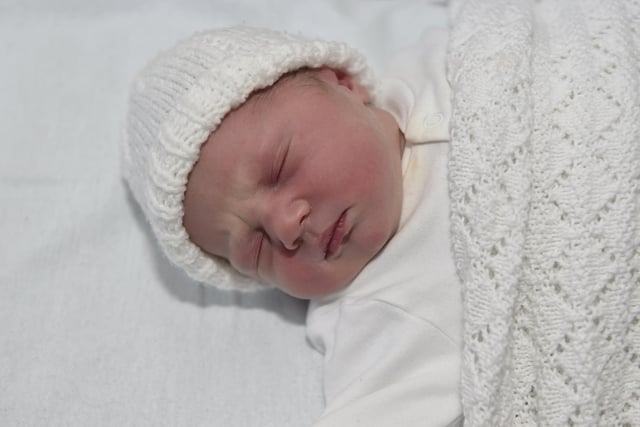 Eva Cooke born on Christmas Day at 7.38am weighing 6lb 14oz to parents Charlotte and Sam Cooke both 34 from Bournemouth. Eva was born via a surrogate from Havant. 

Picture: Sarah Standing