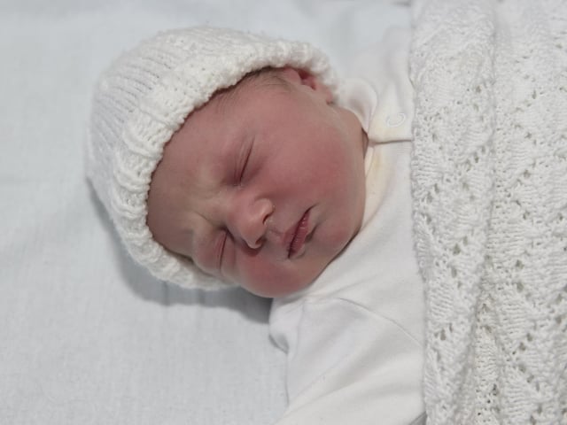 Eva Cooke born on Christmas Day at 7.38am weighing 6lb 14oz to parents Charlotte and Sam Cooke both 34 from Bournemouth. Eva was born via a surrogate from Havant. 

Picture: Sarah Standing