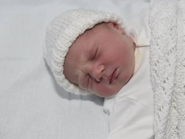 Eva Cooke born on Christmas Day at 7.38am weighing 6lb 14oz to parents Charlotte and Sam Cooke both 34 from Bournemouth. Eva was born via a surrogate from Havant. 

Picture: Sarah Standing