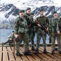 Ian Tennant, pictured in the centre in the green woollen jumper, on a pontoon on South Georgia having been part of the operation to liberate the island from Argentine invaders in 1982