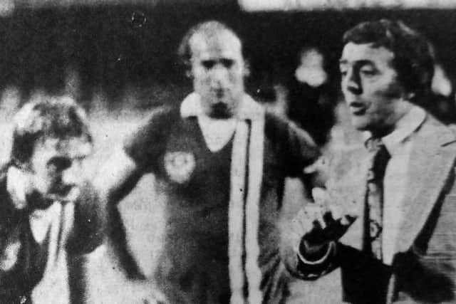 Former Pompey manager Ian St John, right, speaks to the team before they start extra time in their League Cup match against Leicester City in 1976.