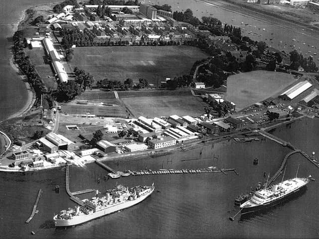HMS Excellent on Whale Island aerial view 1970. Bottom right at her mooring is the Royal Yacht Britannia where she was always located when not in use. The grey ship to the left is HMS Rame Head that was a Canadian ship. She was a training ship later followed by HMS Bristol which still uses the birth to this day. Just above the playing field are the barrack blocks.