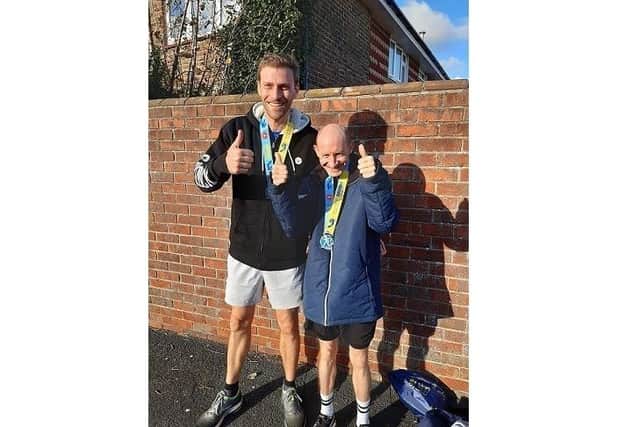 Shane Grant, 39, from Portsmouth who is taking on the London marathon, pictured with his guide runner Lawrence Patterson