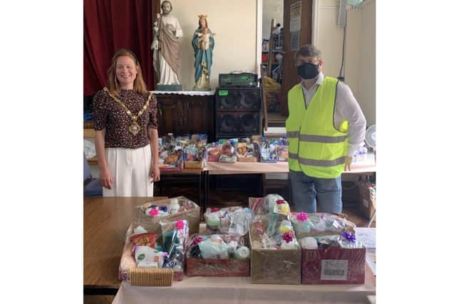 Gosport Open Doors held its fourth lunch for homeless people in the town. Pictured: Zoe Huggins, mayor of Gosport, and Gary Walker from the Open Doors committee with toiletries and snack hampers made by Rachel Mather