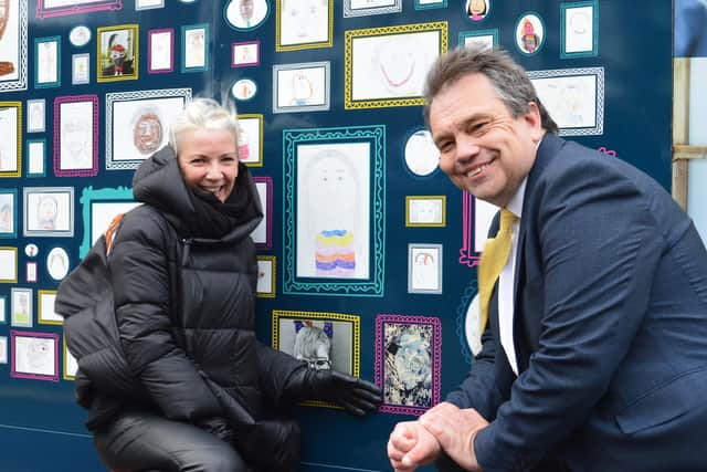 Daughter Helen Goss and Councillor Darren Sanders with Richard's slef portrait at the Somers Town Street Gallery. Picture: PCC