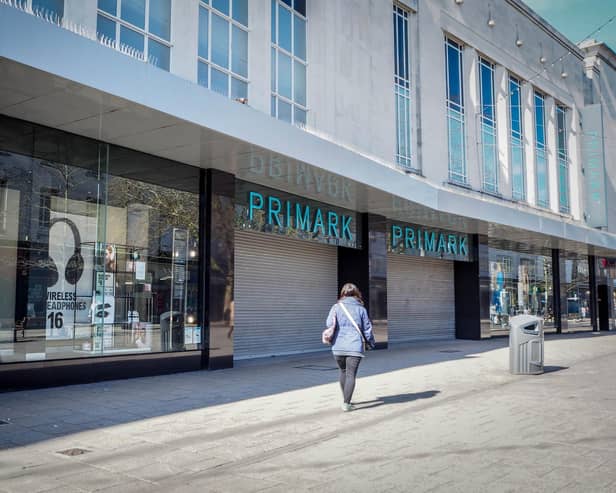 Commercial Road looks eerily empty with Primark shut and only one person visible on the street as the pandemic grips Portsmouth.