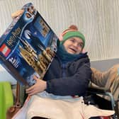 12-year-old Jamie Ancill, who is terminally ill, wasnominated for a national award by Whiteley opticians. As a result, he received his dream Christmas gift - a trip to Legoland and a large box of Lego.
Pictured is Jamie with his mum Emily