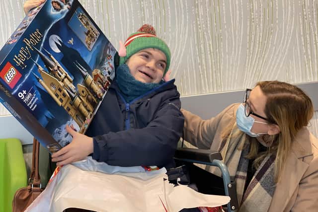 12-year-old Jamie Ancill, who is terminally ill, wasnominated for a national award by Whiteley opticians. As a result, he received his dream Christmas gift - a trip to Legoland and a large box of Lego.
Pictured is Jamie with his mum Emily