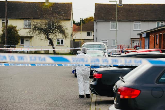 Police in Nobes Avenue, Gosport, after the murder