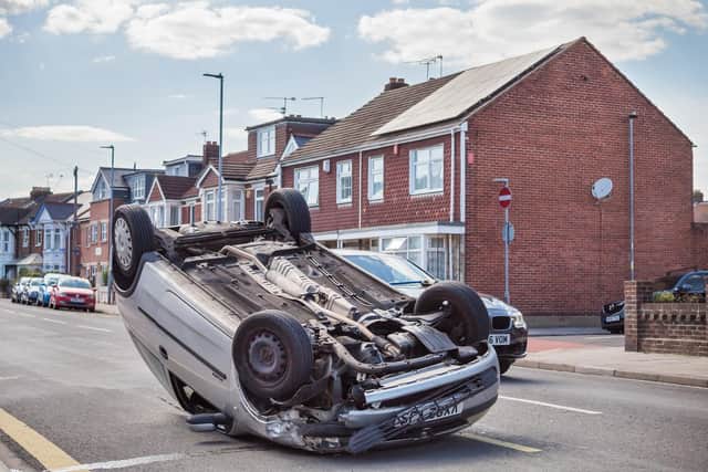 The Vauxhall Corsa overturned in Locksway Road, in Eastney. Picture: Mike Cooter