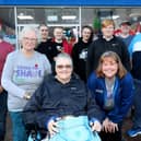 Standing left to right, Connor Lewis, Anne Stigar, Robert Hicks, Marcus Thomas, Sam Thomas, Brendan Thomas, David Ashby, front, Pauline Nolan and Jeanette Thomas. Jeanette Thomas and family and friends have their heads shaved for Macmillan in Gosport High StreetPicture: Chris Moorhouse (jpns 121122-43)