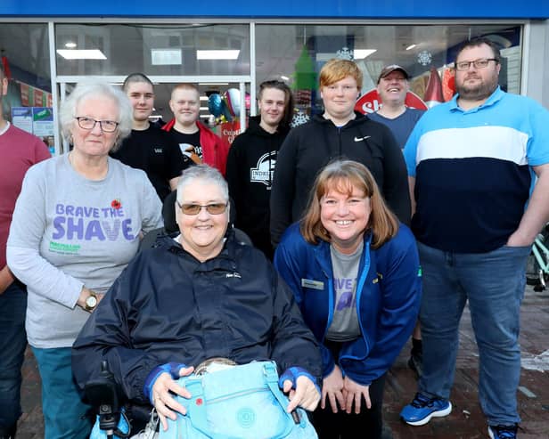 Standing left to right, Connor Lewis, Anne Stigar, Robert Hicks, Marcus Thomas, Sam Thomas, Brendan Thomas, David Ashby, front, Pauline Nolan and Jeanette Thomas. Jeanette Thomas and family and friends have their heads shaved for Macmillan in Gosport High Street
Picture: Chris Moorhouse (jpns 121122-43)