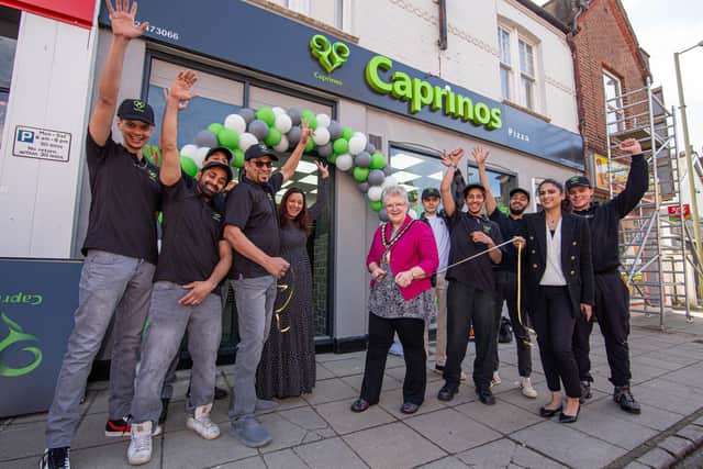 Caprinos Pizza, Havant officially opens its doors on Wednesday, April 13 2022.Pictured: Lord Mayor of Havant, Councillor Rosy Raines cutting the ribbon wih staff of Caprinos Pizza Picture: Habibur Rahman