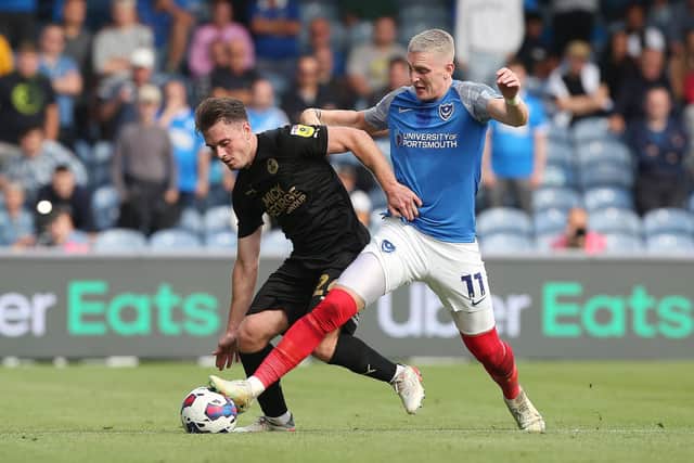 Ronan Curtis, pictured battling with Ben Thompson against Peterborough, welcomed a son into the world last week.