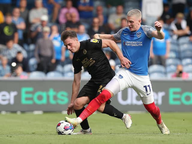 Ronan Curtis, pictured battling with Ben Thompson against Peterborough, welcomed a son into the world last week.