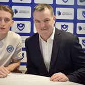 Ronan Curtis signs his new Pompey contract with chief operating officer Tony Brown. Picture: Portsmouth FC